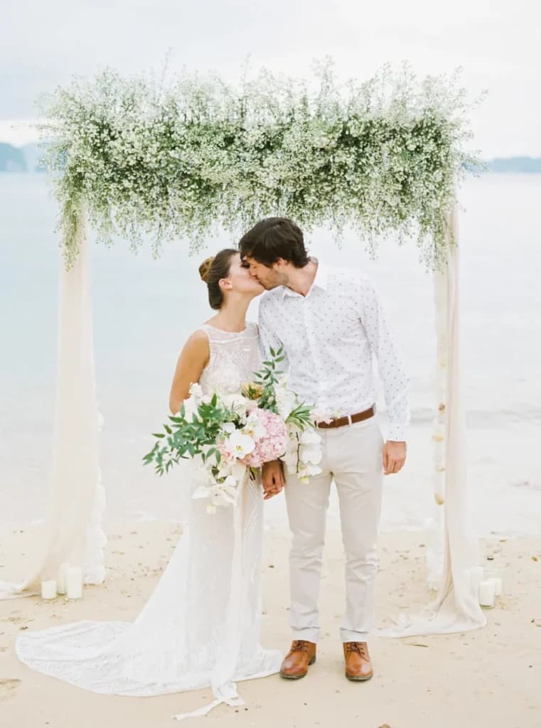 Couple getting married by the beachside of Thailand. 