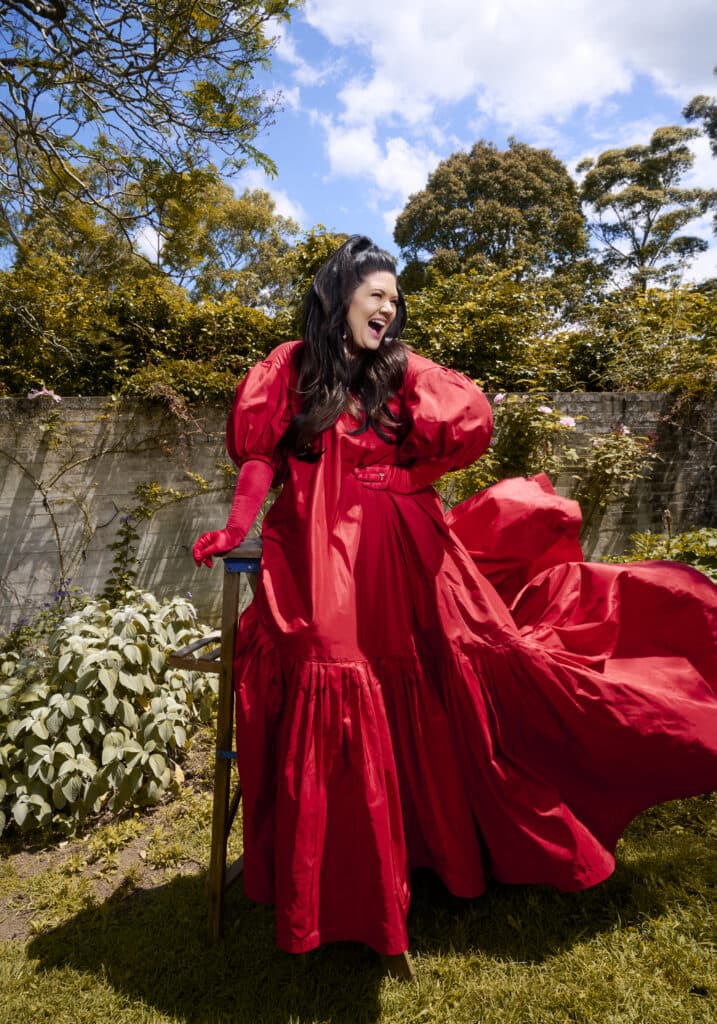 Tanya Hennessy adorns a red evening gown.