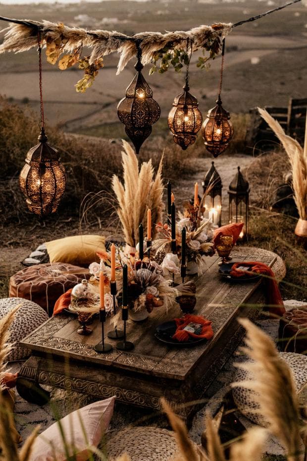 Bohemian themed destination wedding with patterned rugs and colorful cushions