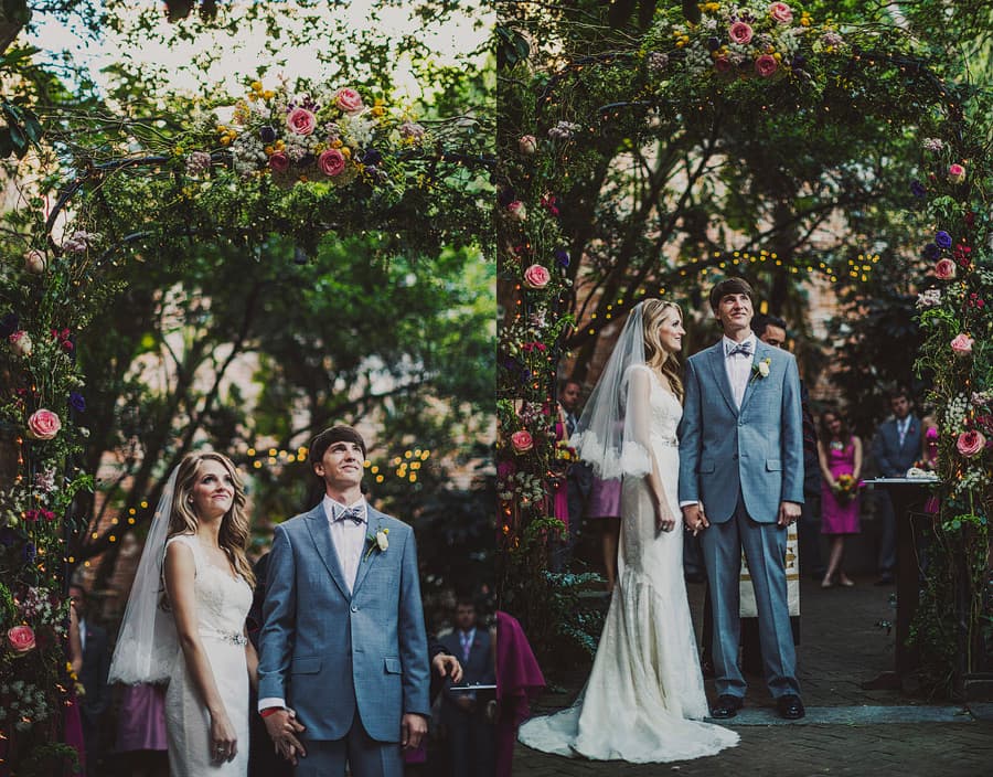 Garden themed destination wedding couple surrounded by nature and wedding guests