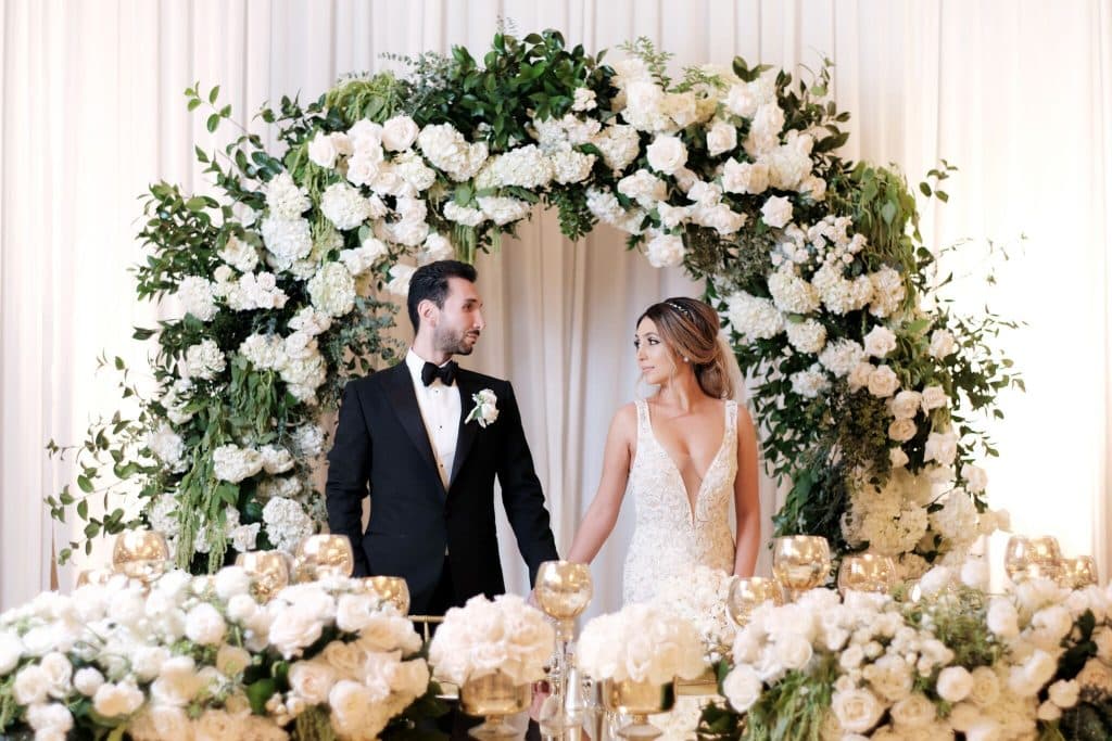 Floral Arches and Golden Candlelight At The Hilton LA