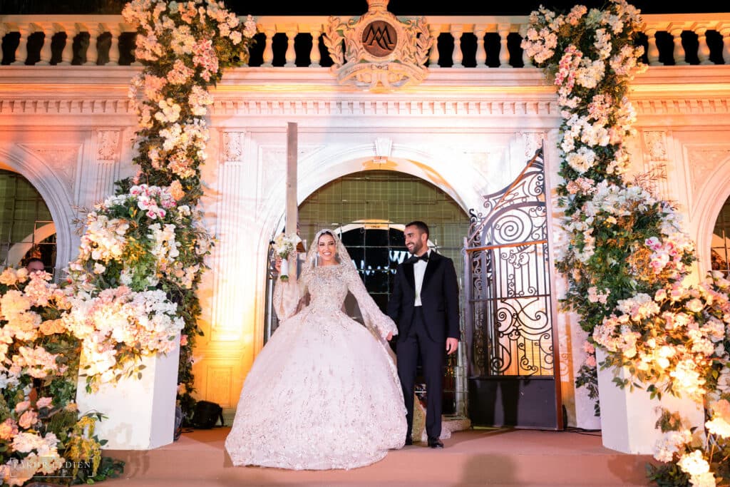 The newlyweds in all smiles as they enter their wedding party. 