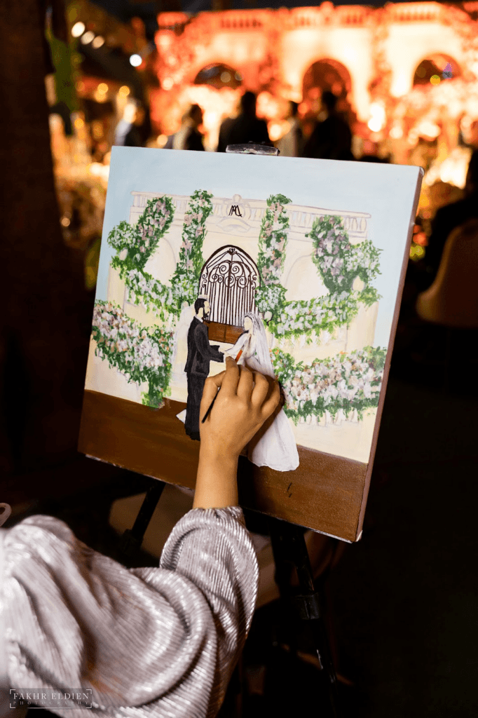 The couple had a painter capture a special moment in real time.