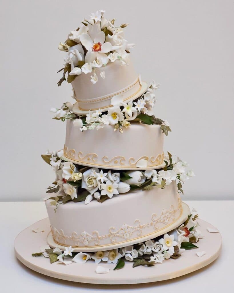 Unique lopsided cake with beautiful florals.