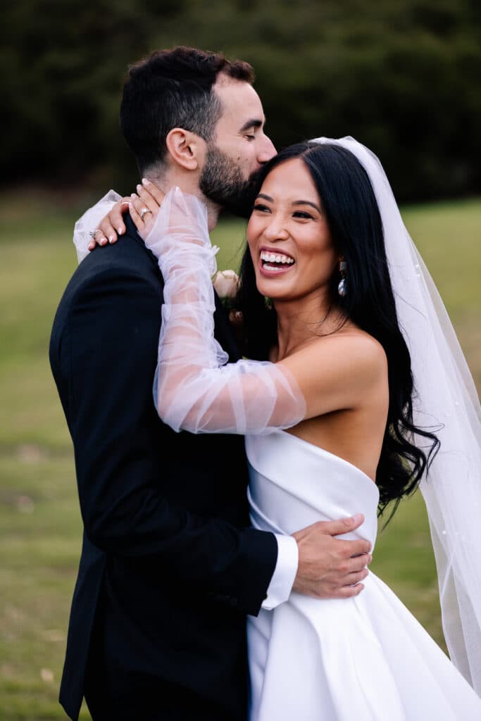 Couple smiling on their wedding day