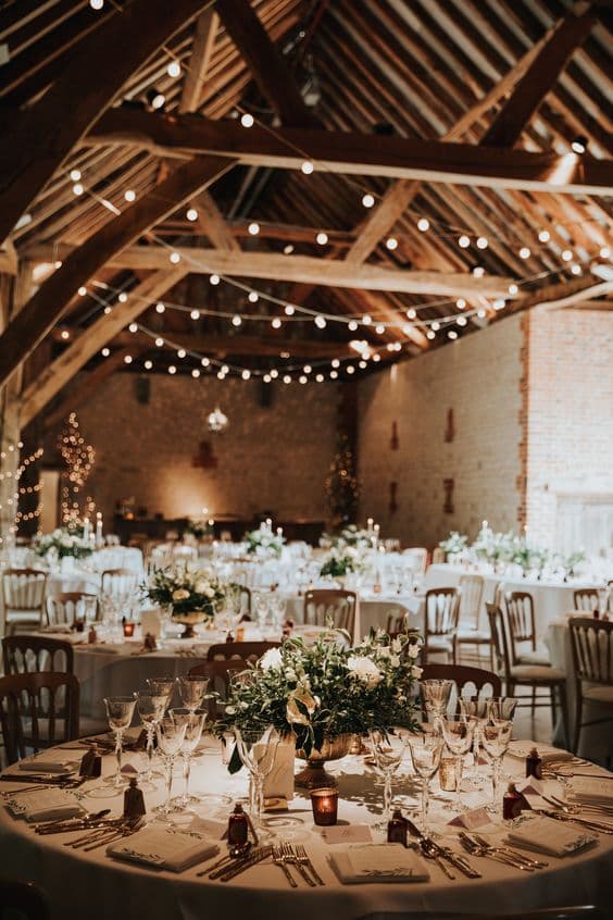 Rustic vibes for wedding reception held in a barn. 