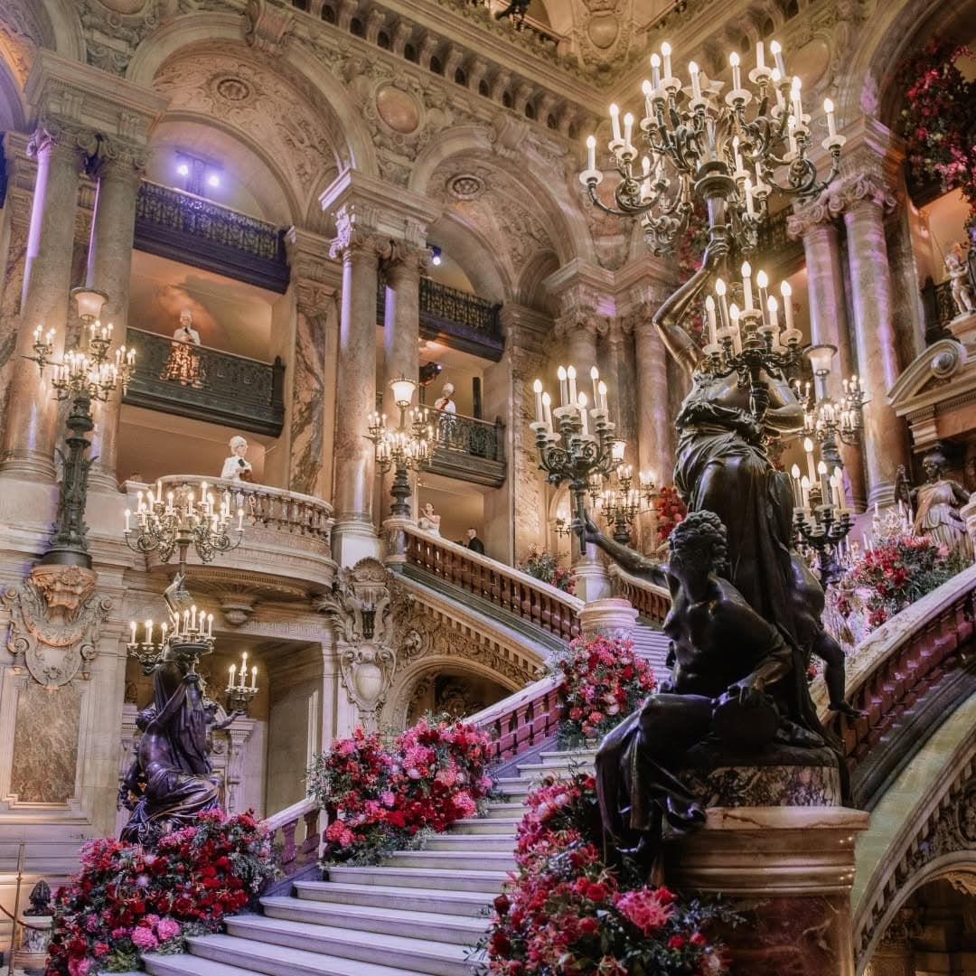 Grand interior with staircase and chandeliers