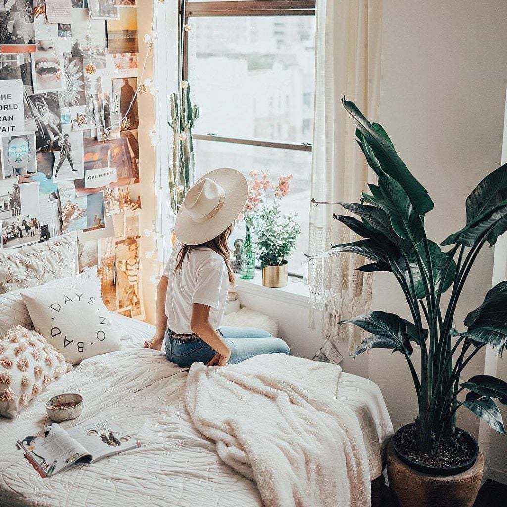 Girl Sitting On Bed