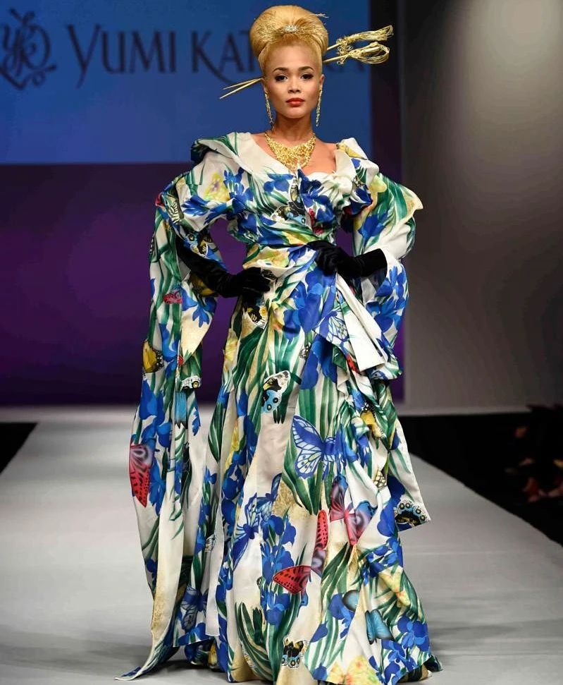 Non-traditional Japanese kimono with blue and green accents and a gold statement headpiece