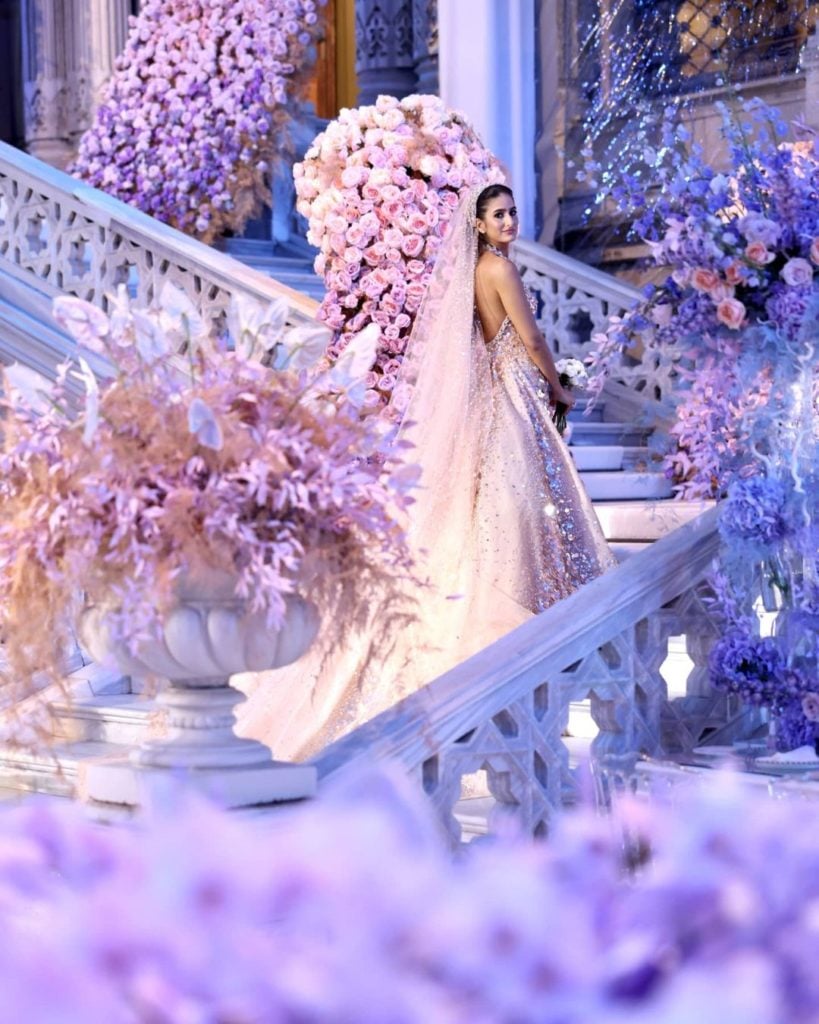 Breathtaking bride surrounded by blooming flowers