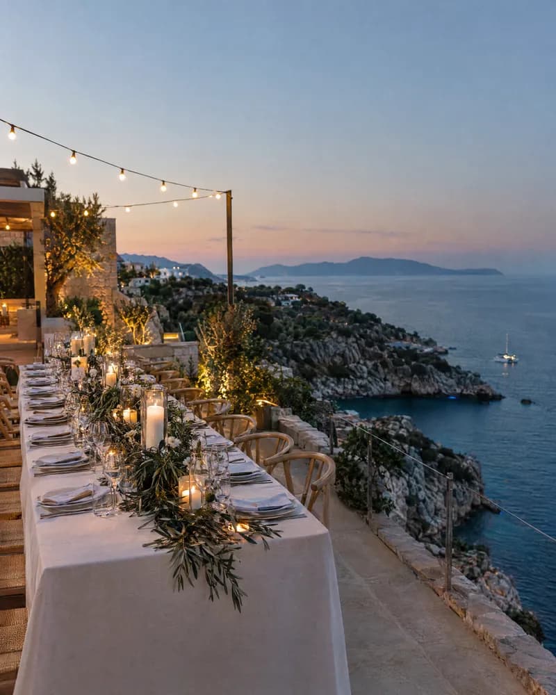 A clifftop wedding reception on the Athens Riviera at blue hour