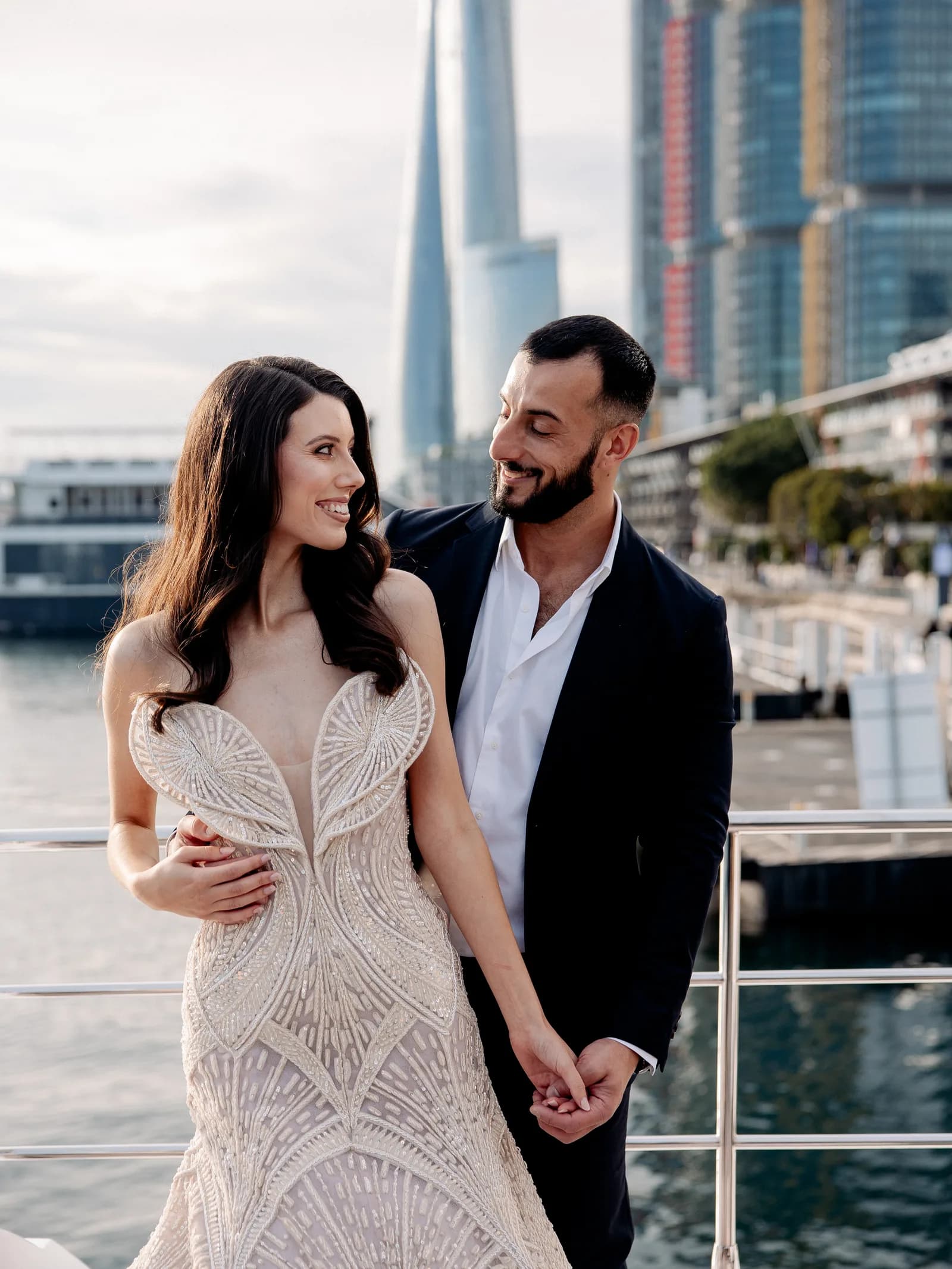 A couple together on the Sydney waterfront at Wedded World