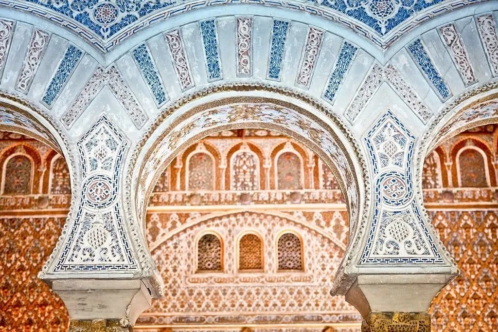 Carved and tiled arches inside the Royal Alcázar of Seville