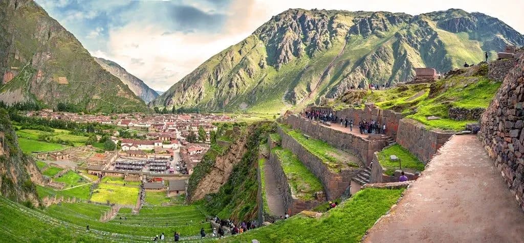 Green Inca terraces climbing the hillside above Ollantaytambo in the Sacred Valley