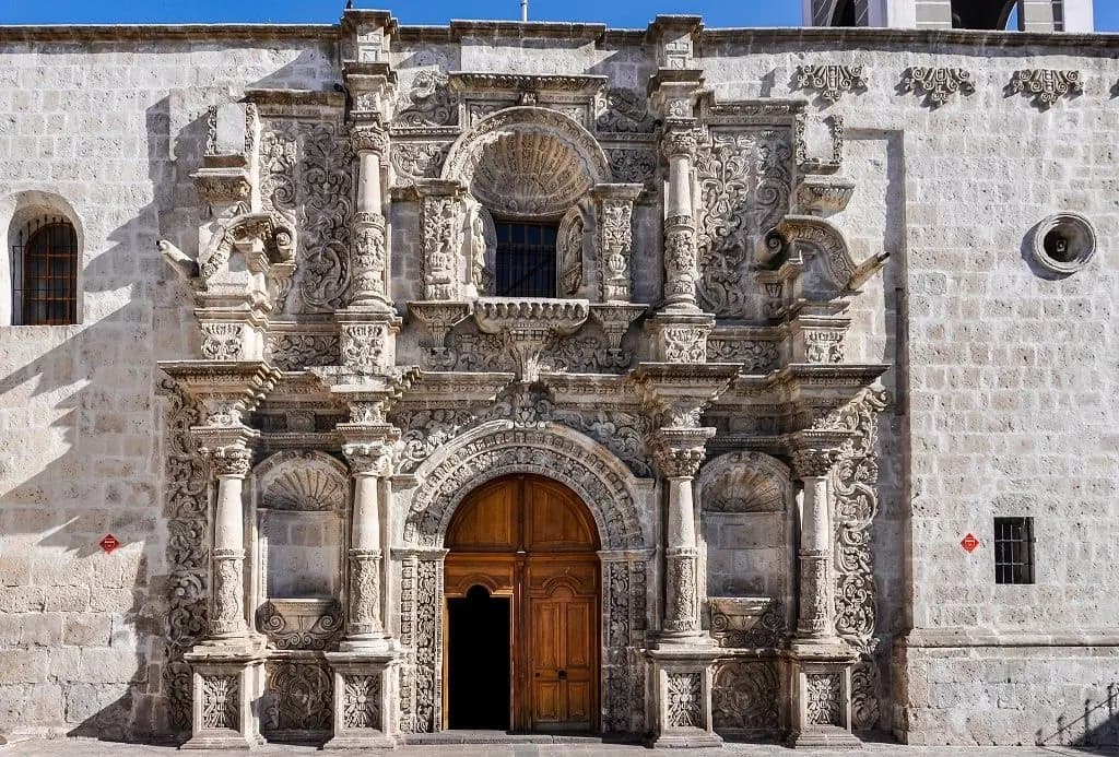 The carved white stone front of a colonial church in Arequipa