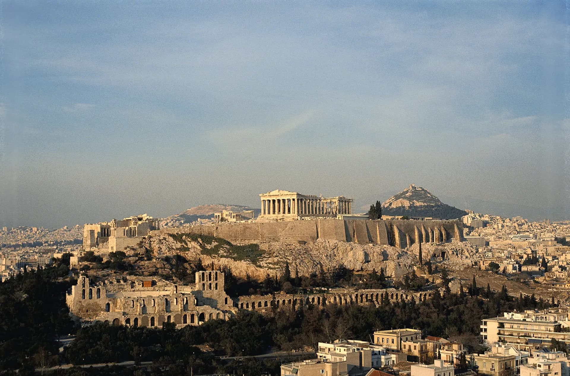 The Acropolis hill and the Parthenon above Athens in soft evening light