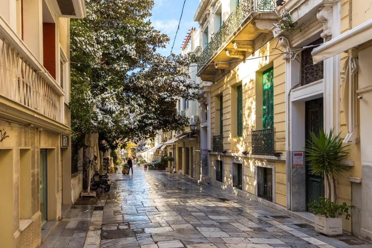 A quiet paved street of neoclassical houses in central Athens