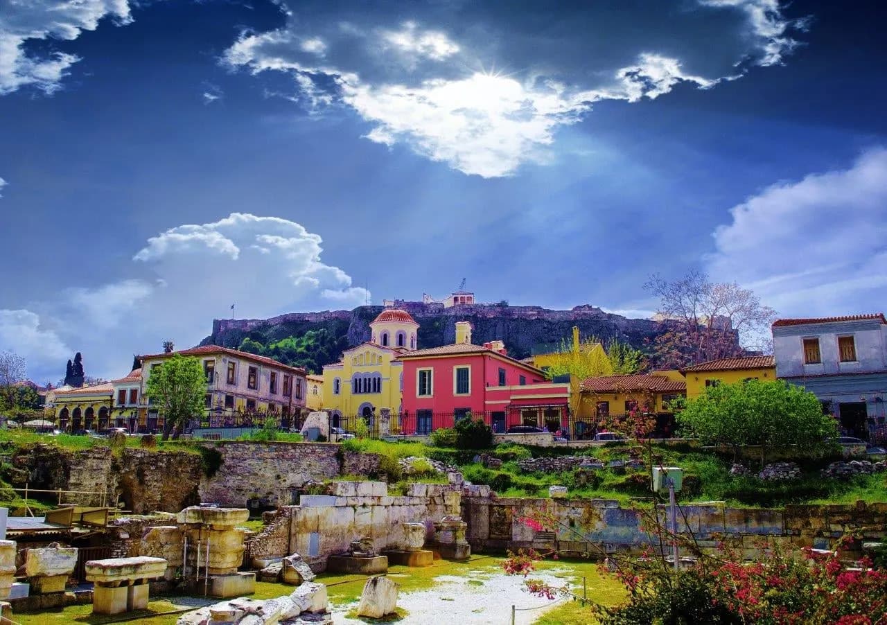 Colourful houses and ancient ruins below the Acropolis in Athens