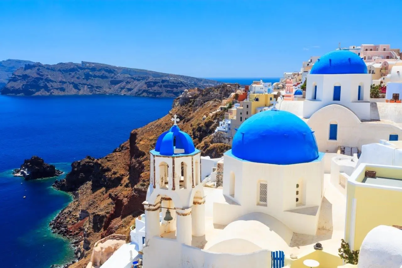 Blue domed churches above the caldera in Oia, Santorini