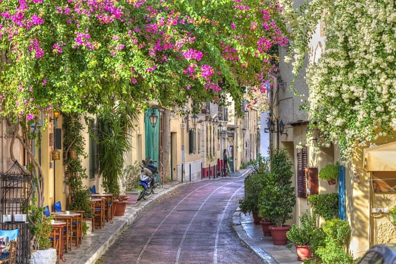 A quiet Plaka lane under pink bougainvillea