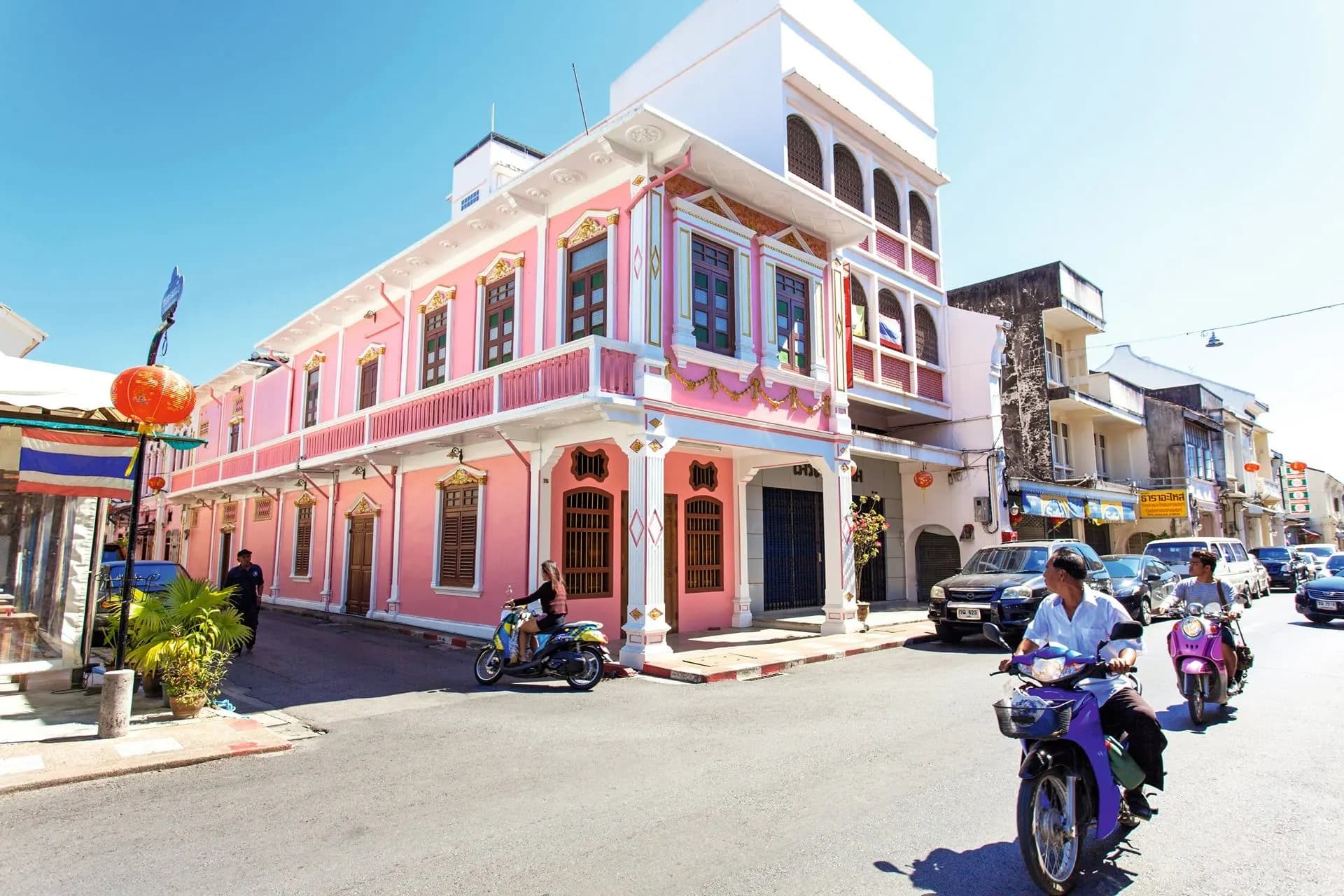 A pink colonial-style shophouse on a corner in Phuket Old Town