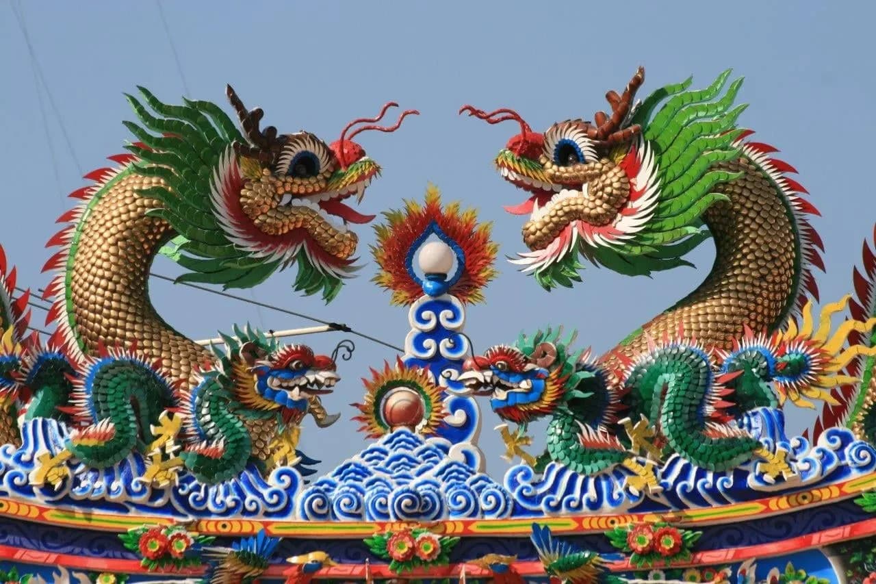 Two colourful dragons on the roof of a Chinese temple