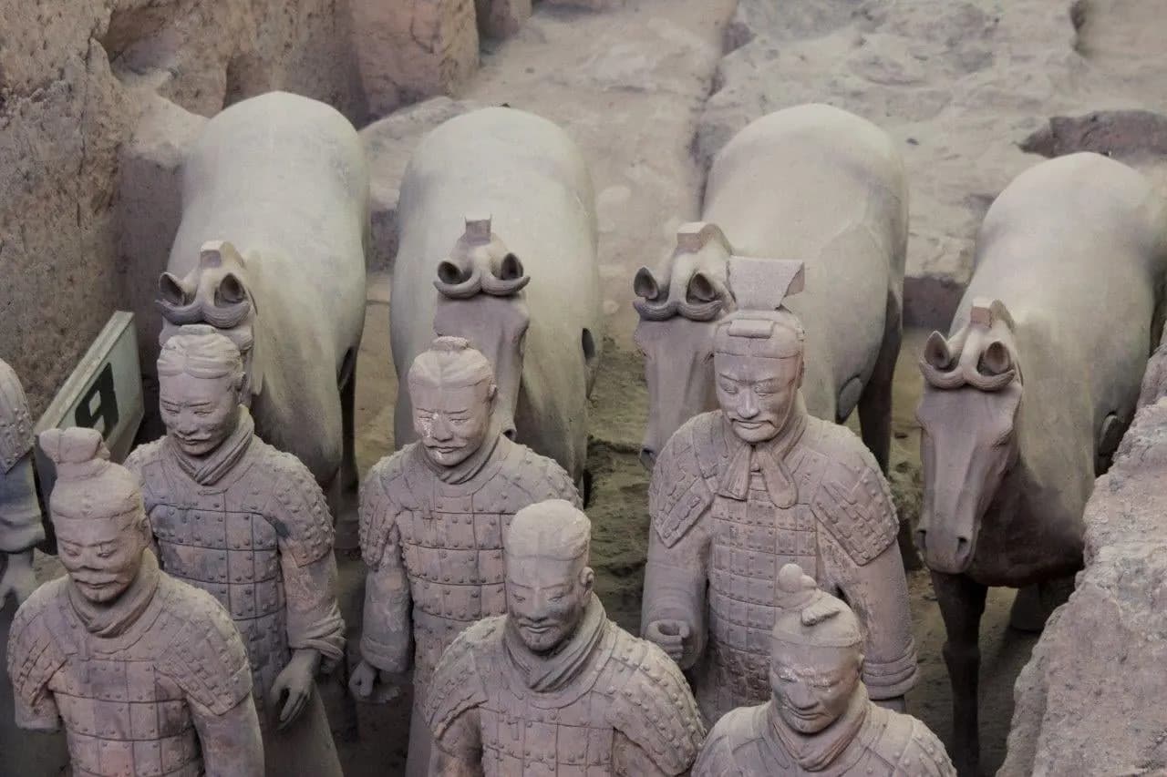Terracotta warriors and horses lined up in the pits