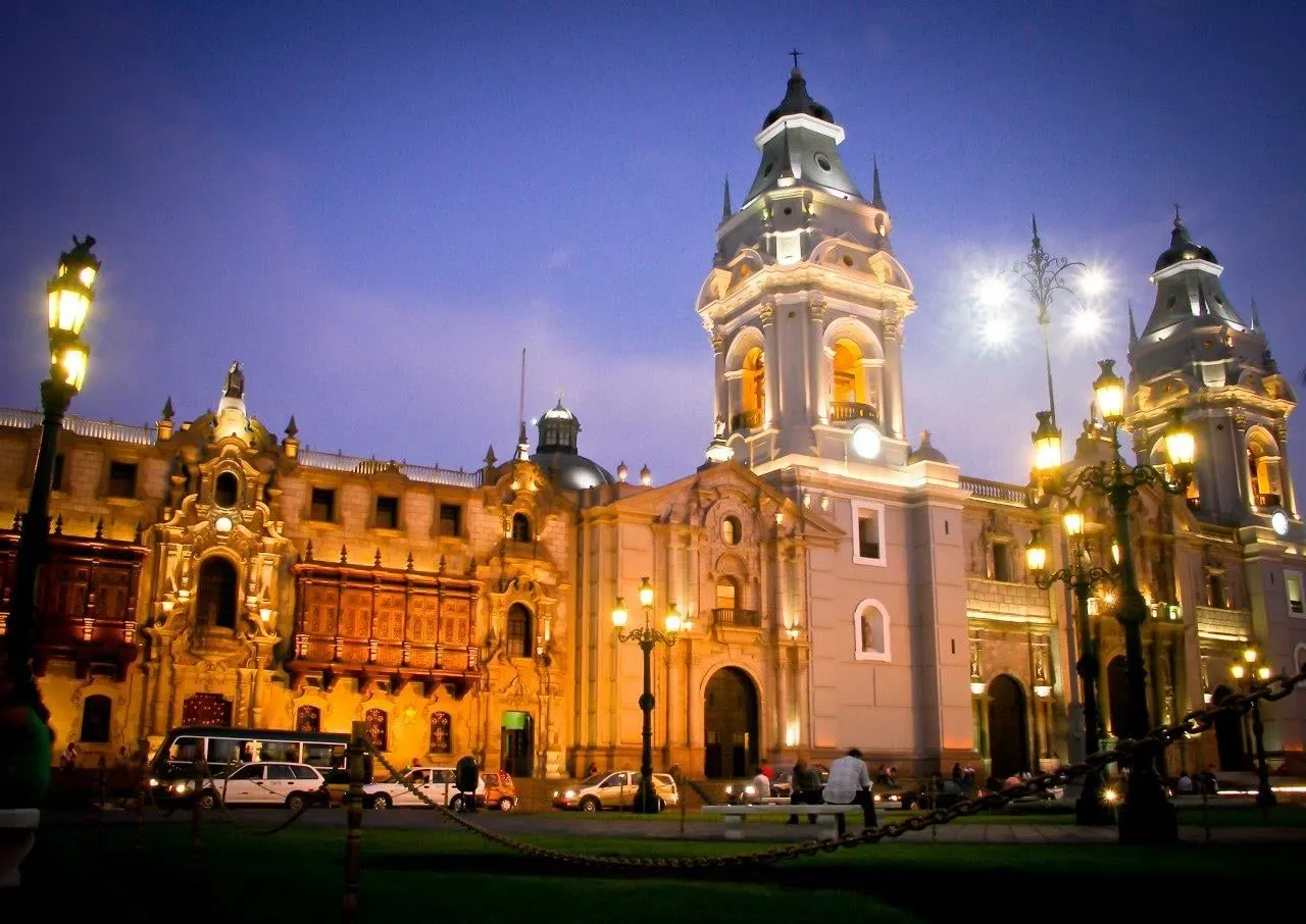 The cathedral on the main square in Lima lit up at dusk