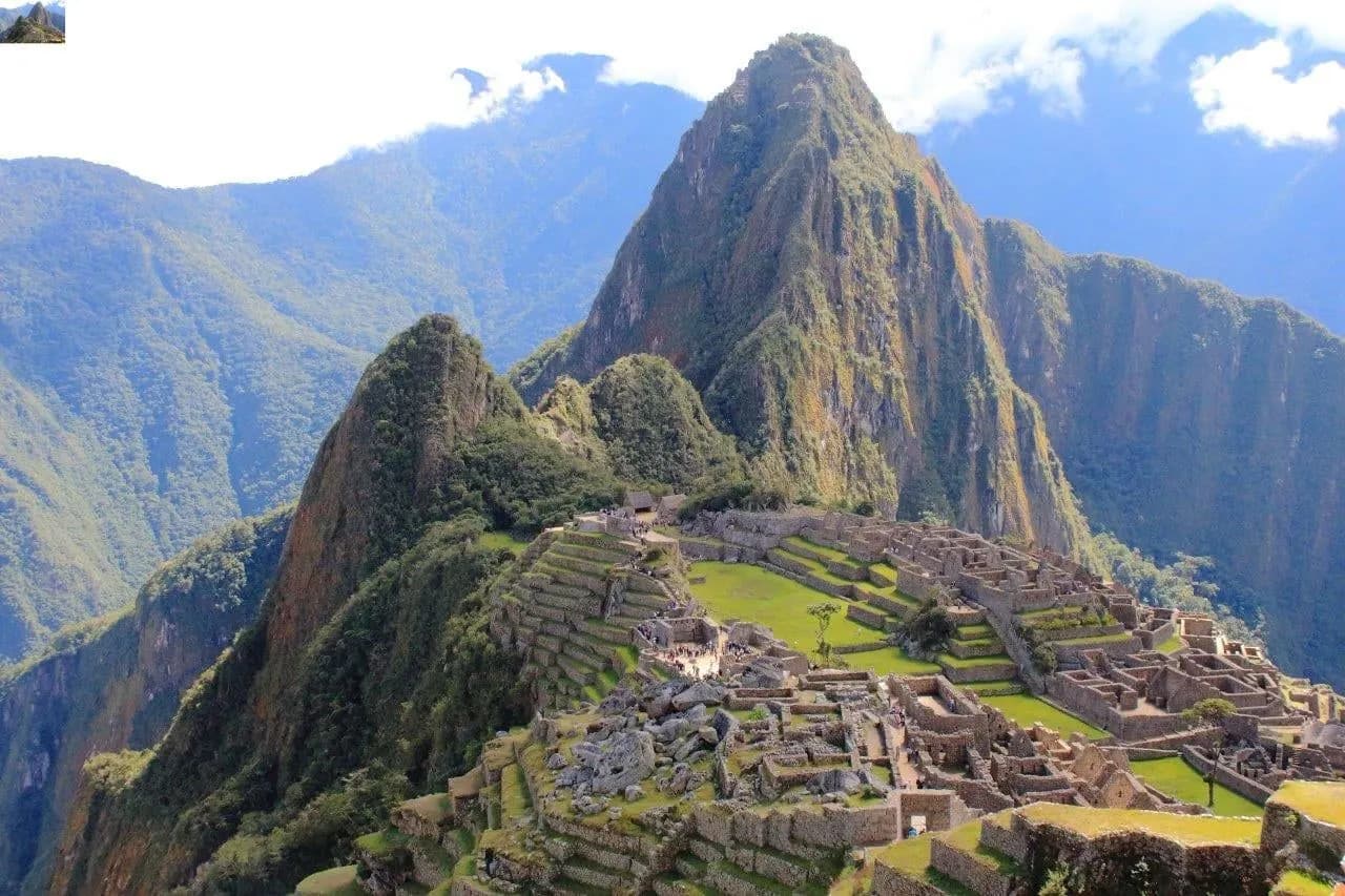 Machu Picchu on its ridge below the peak of Huayna Picchu