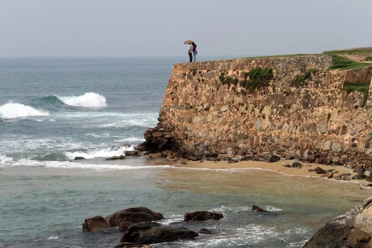 Waves breaking below the stone ramparts of Galle Fort