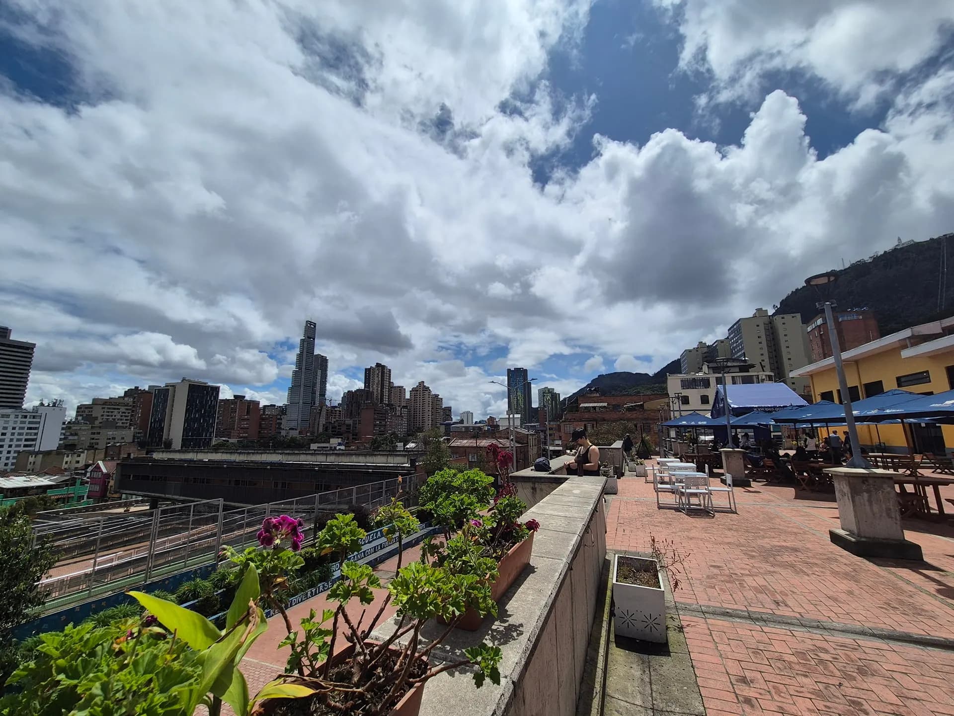 The Bogotá skyline and Andean hills seen from a terrace