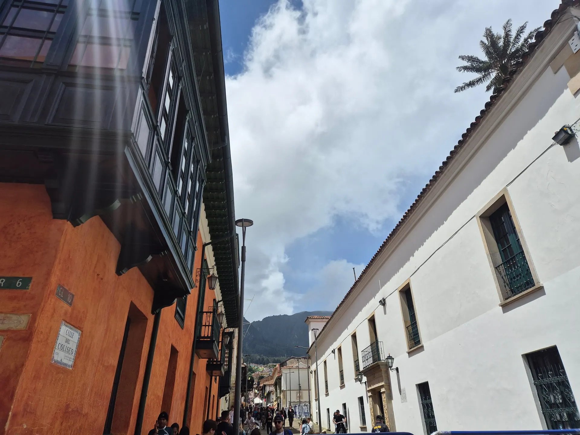 White and terracotta colonial houses with wooden balconies on a Bogotá street