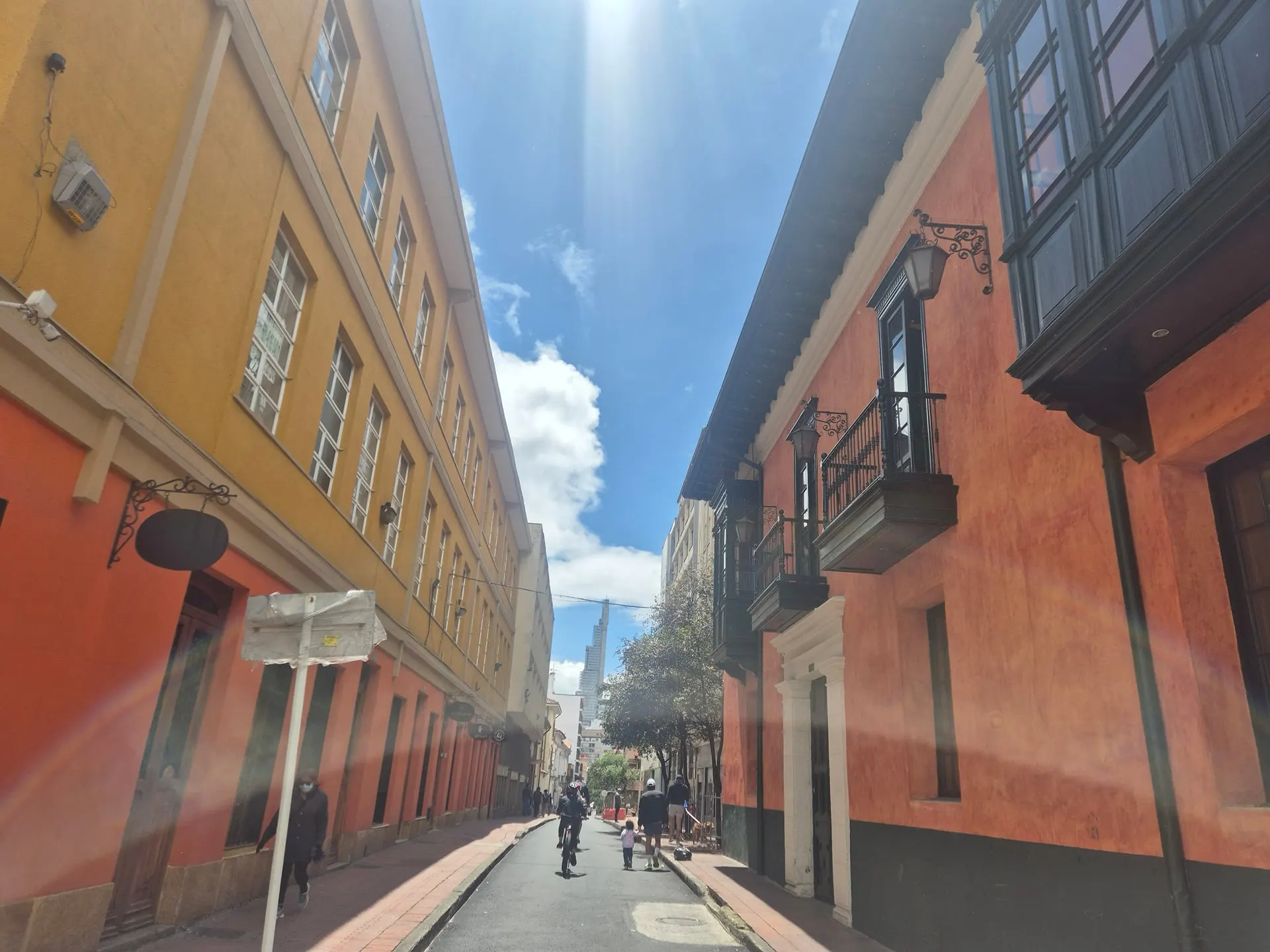 Ochre and red colonial buildings along a narrow lane in the old town