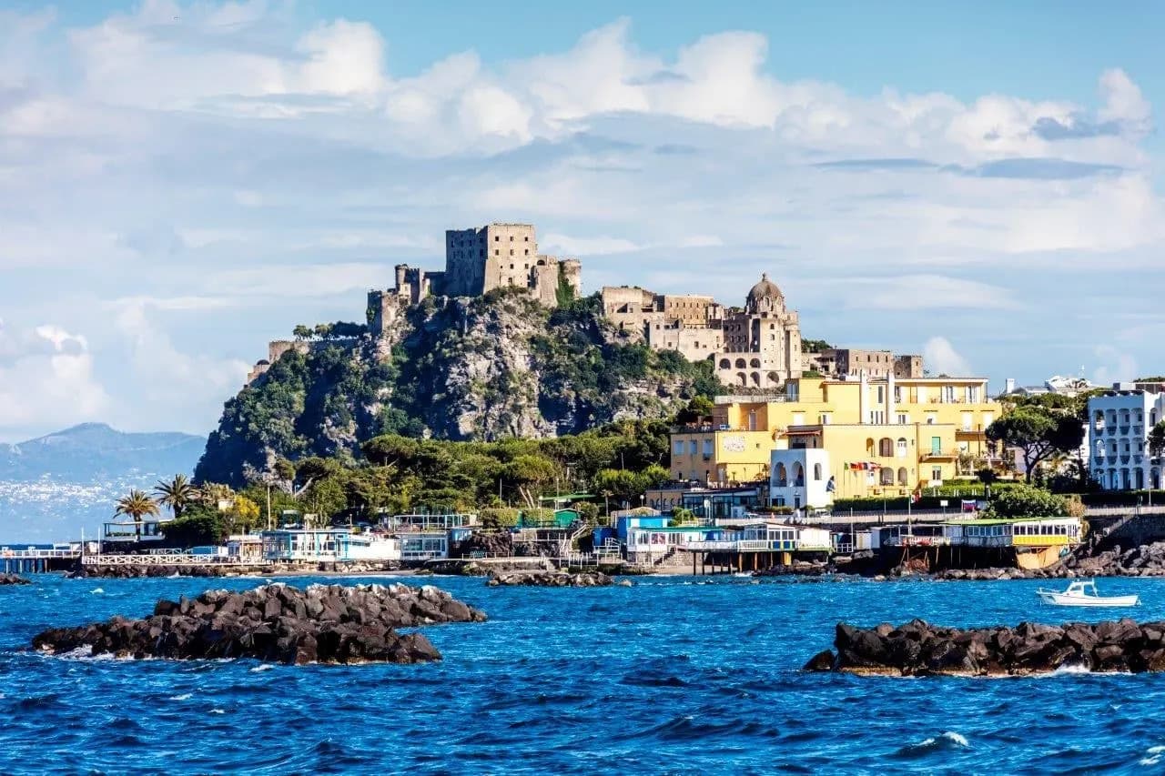 The Aragonese Castle on its rocky islet off Ischia, with the town along the water