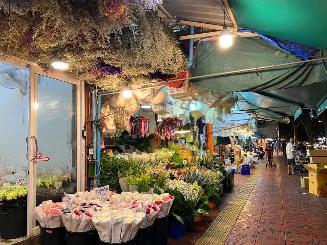 Flower stalls under awnings at Pak Khlong Talat in Bangkok