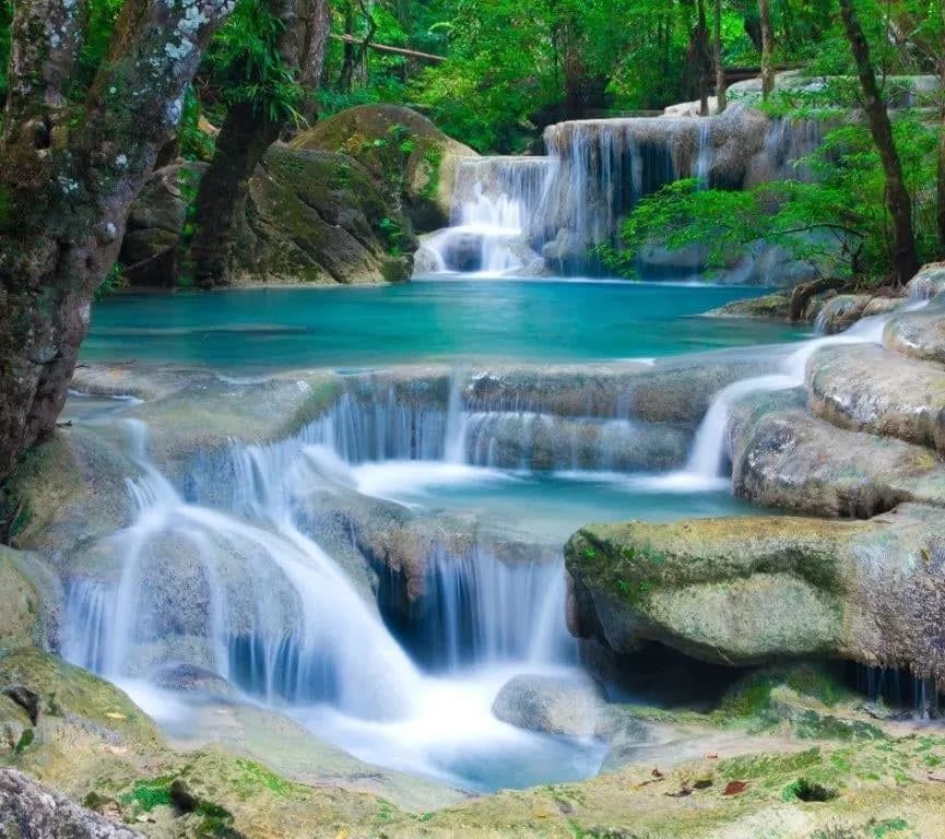 Waterfalls tumbling into turquoise pools in the forest