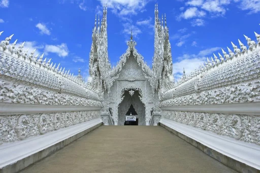 The white walls and spires of Wat Rong Khun in Chiang Rai