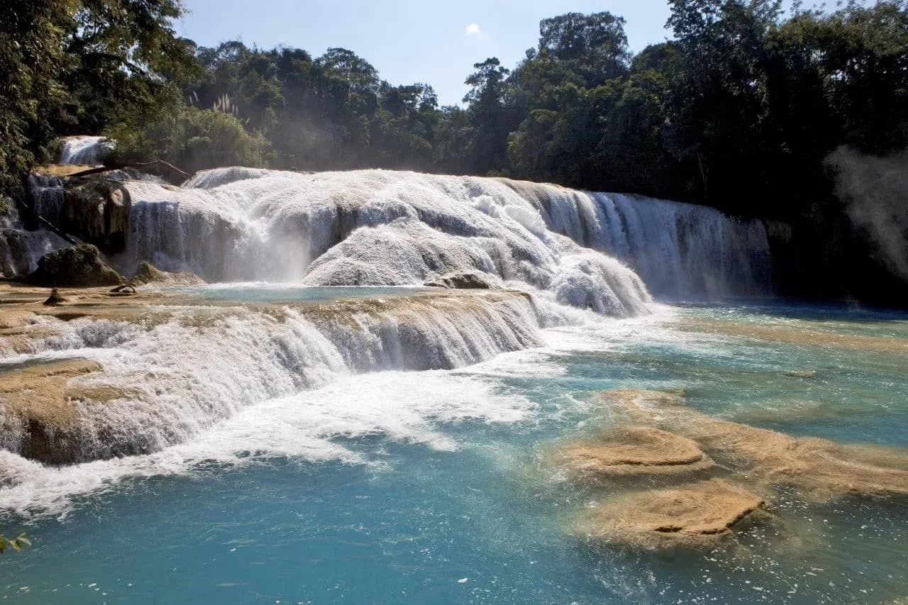 White cascades tumbling into turquoise pools at Agua Azul