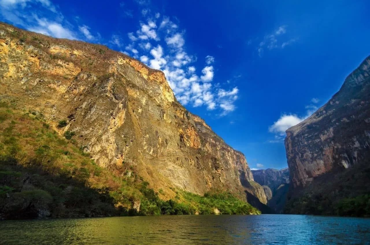 Sheer cliffs of the Sumidero Canyon rising straight from the river