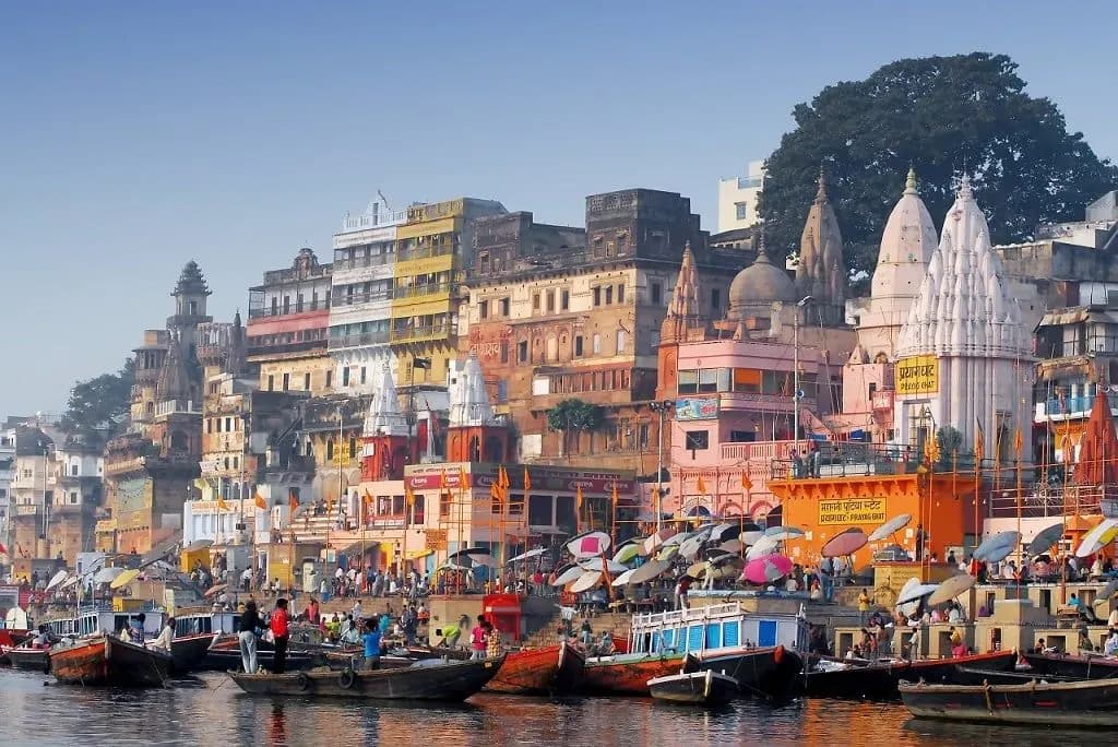 Boats moored below the temples and ghats of Varanasi on the Ganges