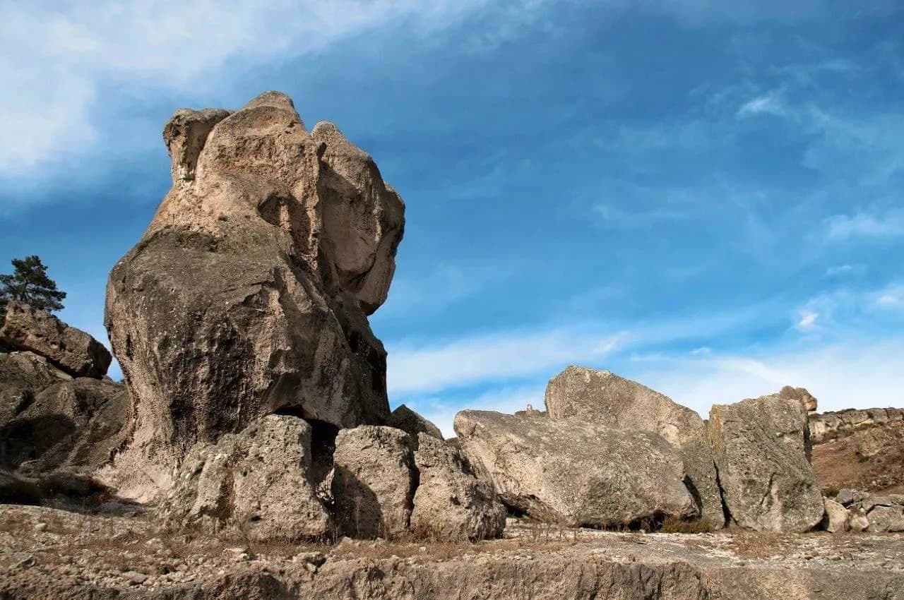 Tall weathered rock formations against a blue sky in the Sierra Tarahumara