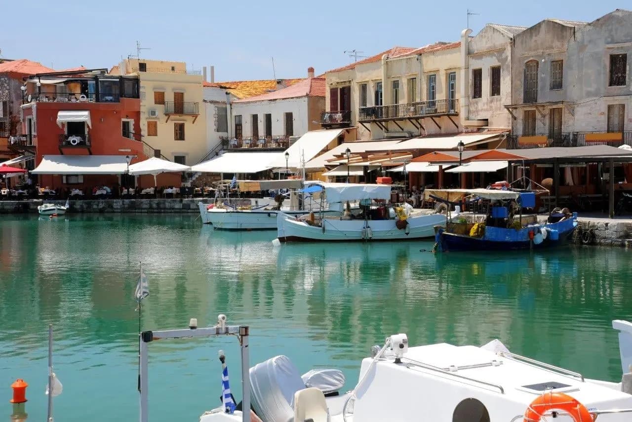 Boats in the old harbour of Rethymno, in front of waterside tavernas