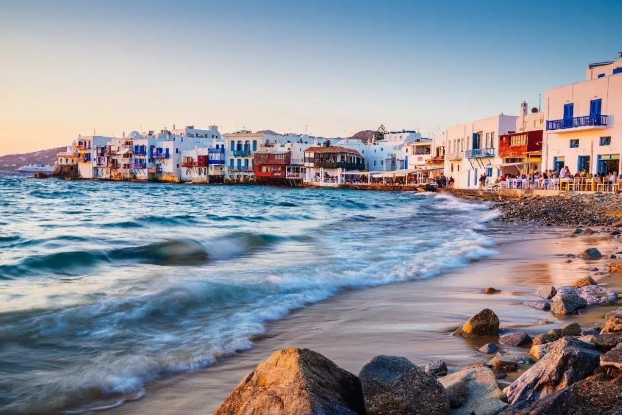 Waves breaking below the waterfront houses of Little Venice on Mykonos