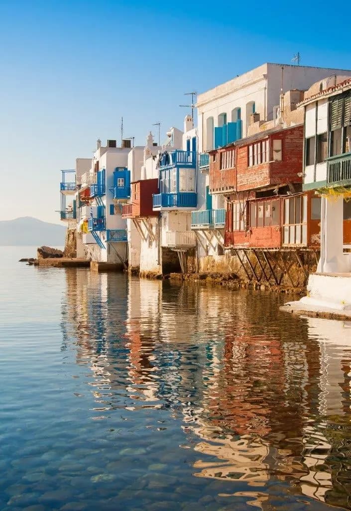 Colourful houses with balconies built over the water in Little Venice, Mykonos