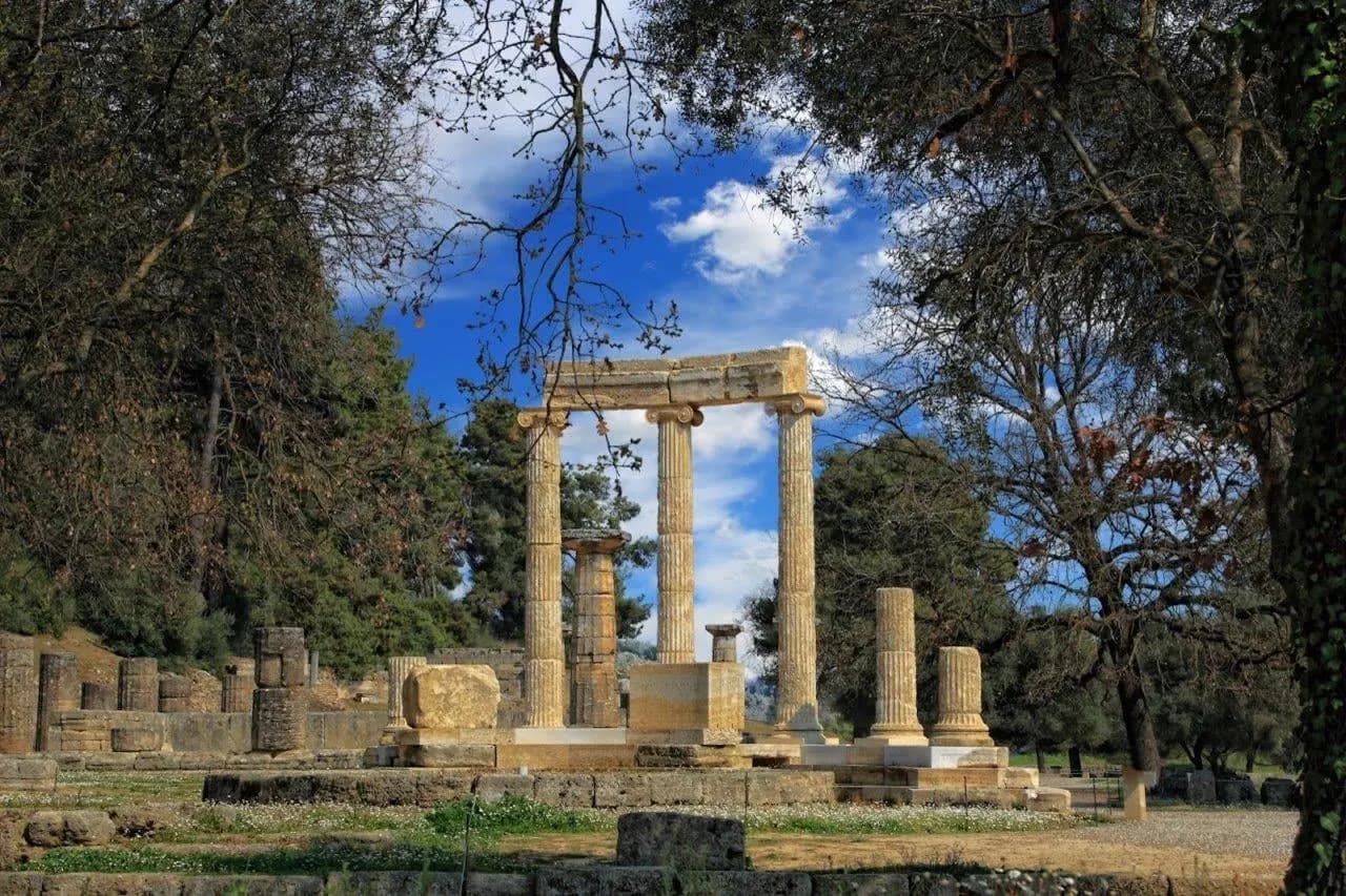 Ancient columns standing among the trees at Delphi