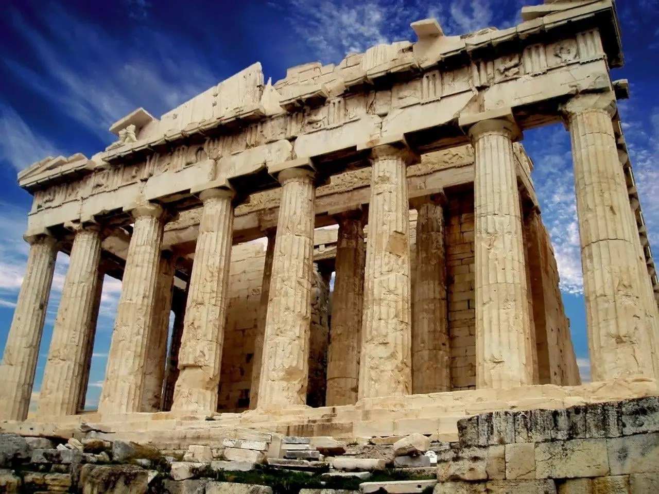 The columns of the Parthenon against a deep blue sky