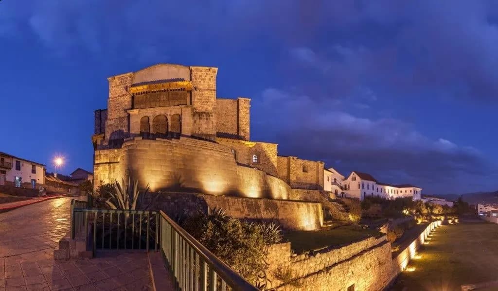 The Coricancha and Santo Domingo church lit up at dusk in Cusco