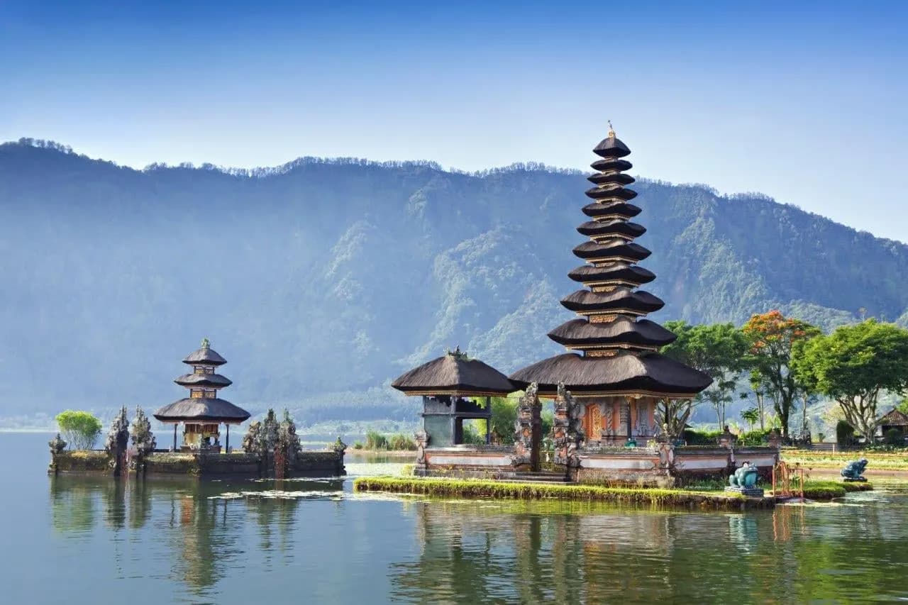 The tiered shrines of Ulun Danu temple on Lake Beratan below the mountains
