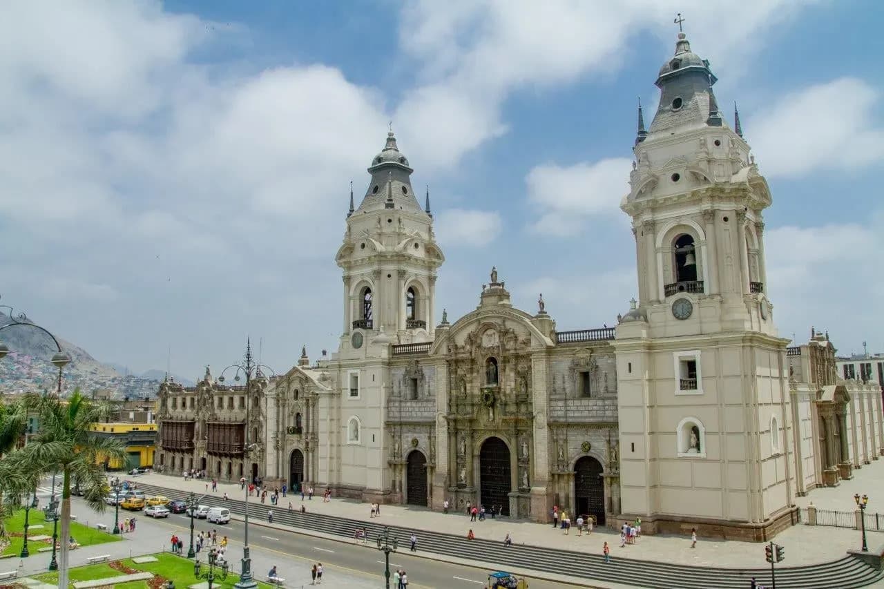 Lima's cathedral and the Plaza de Armas under a cloudy sky