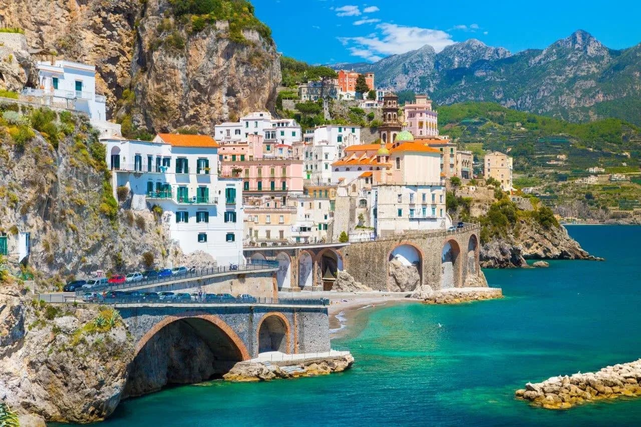 White houses and stone arches along the coast road of the Amalfi Coast